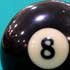 Eight ball on pool table.